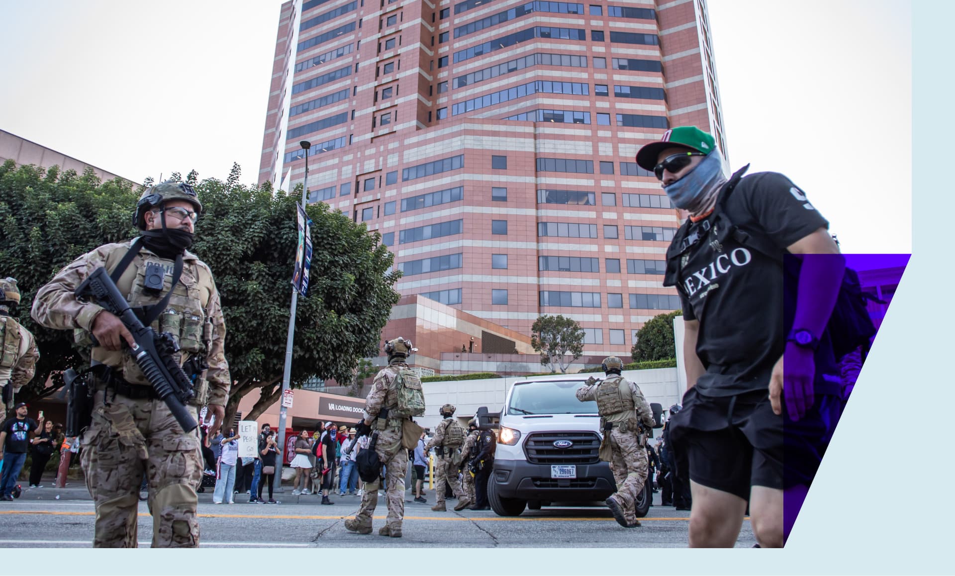 Marines protect the U.S. Customs and Border Protector cars while they leave the Edward R. Roybal Federal and Detention Center building during a protest against ICE raids and the presence of the U.S. military in civilian spaces