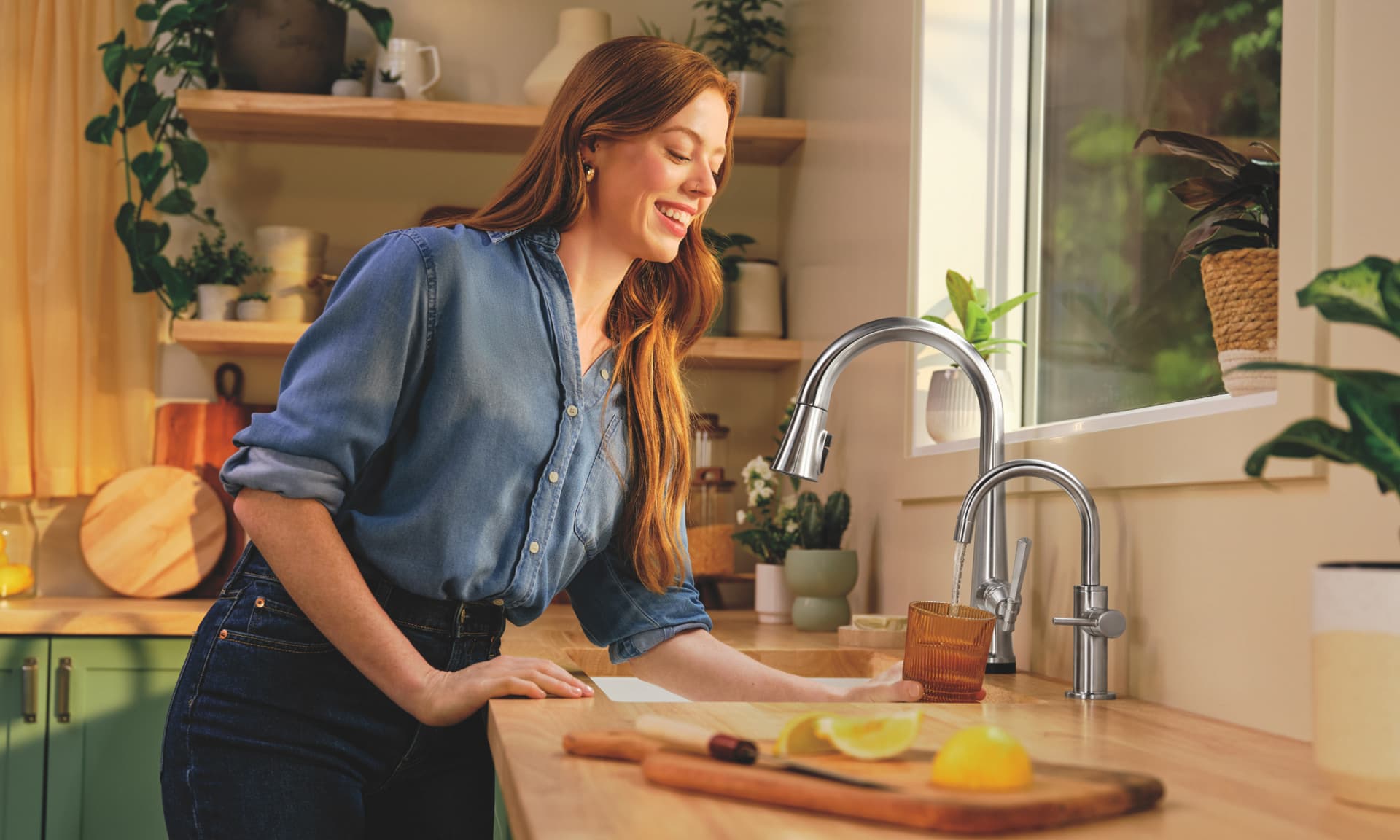 woman in kitchen with delta faucet