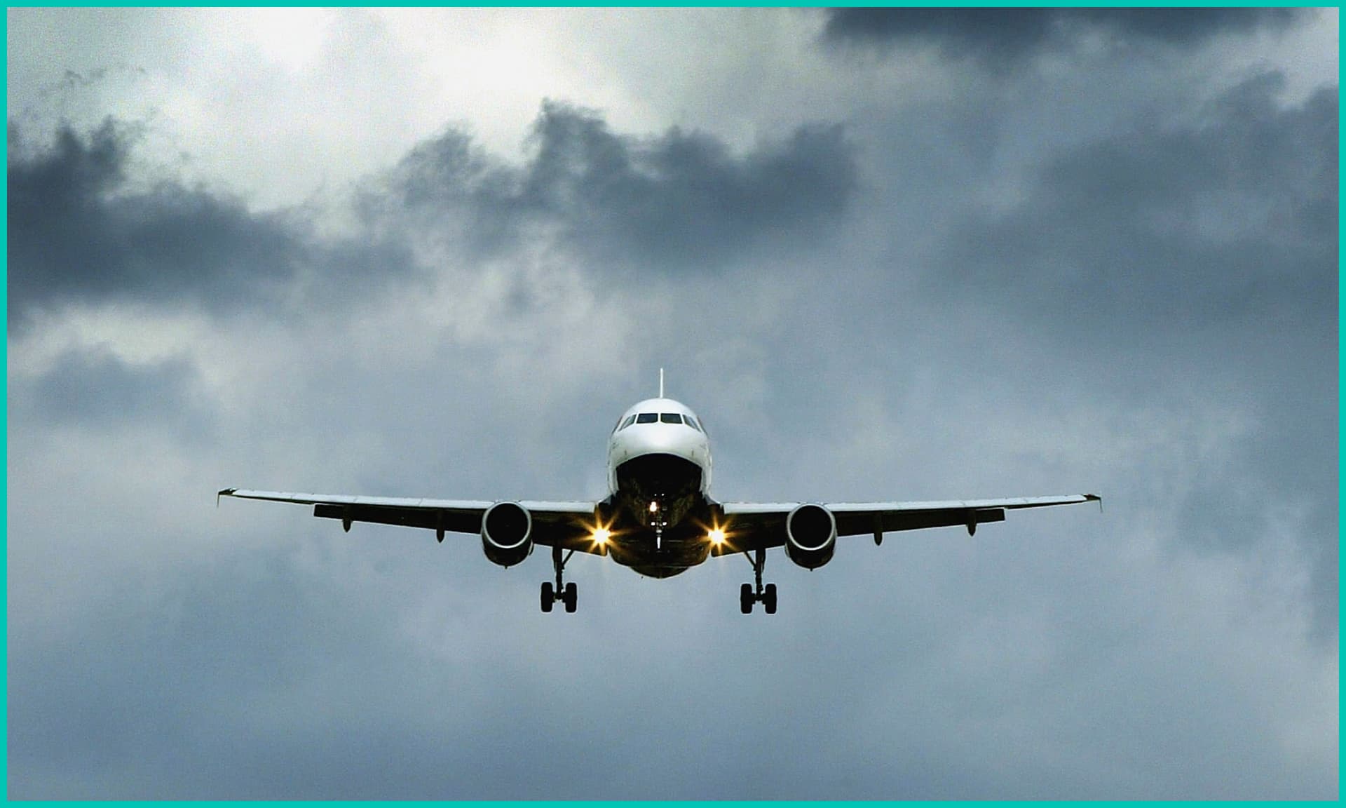 An airplane flying in cloudy skies
