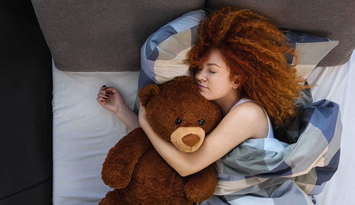 Featured image for Is It Healthy to Still Sleep With Stuffed Animals as an Adult? Here’s What the Experts Say