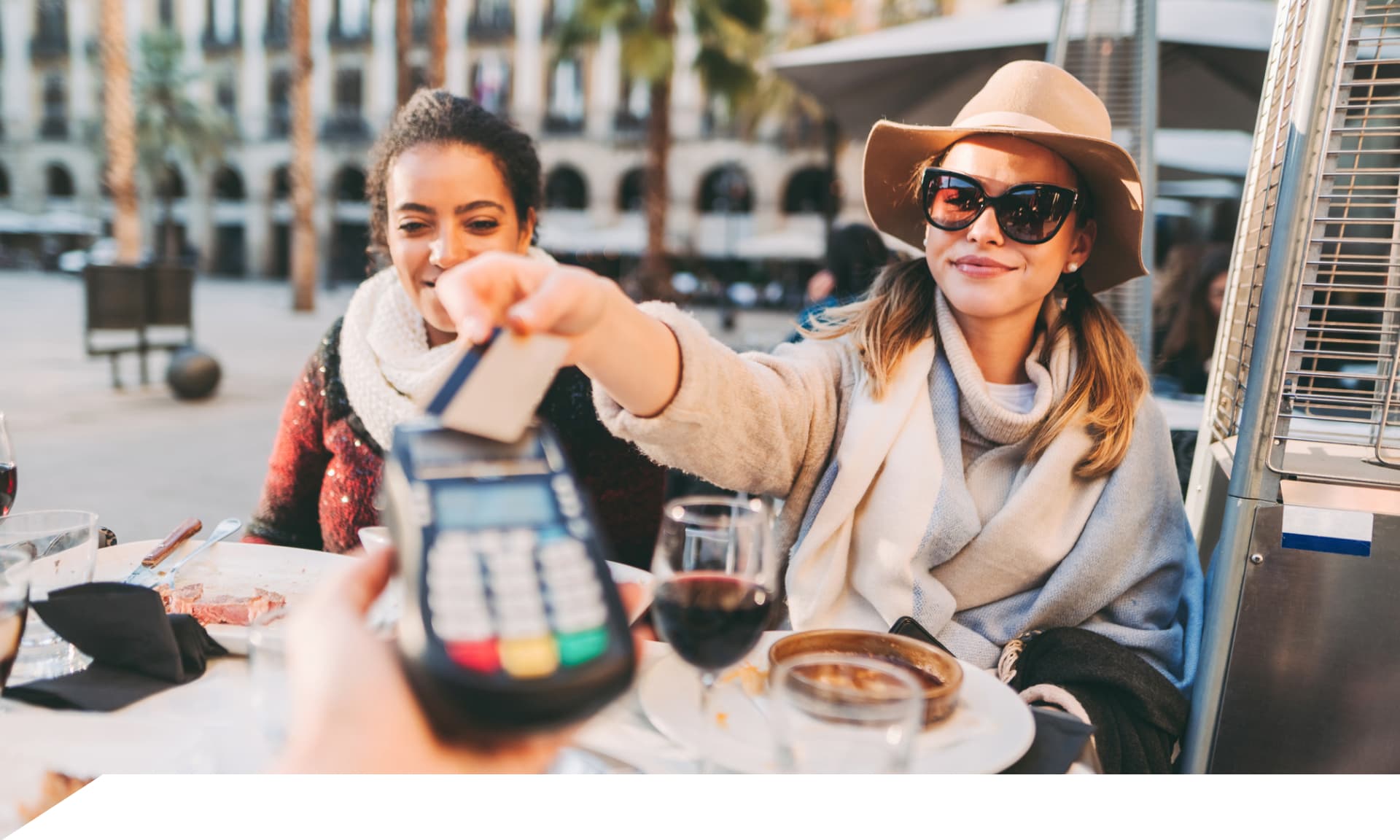Two women buying food with credit card
