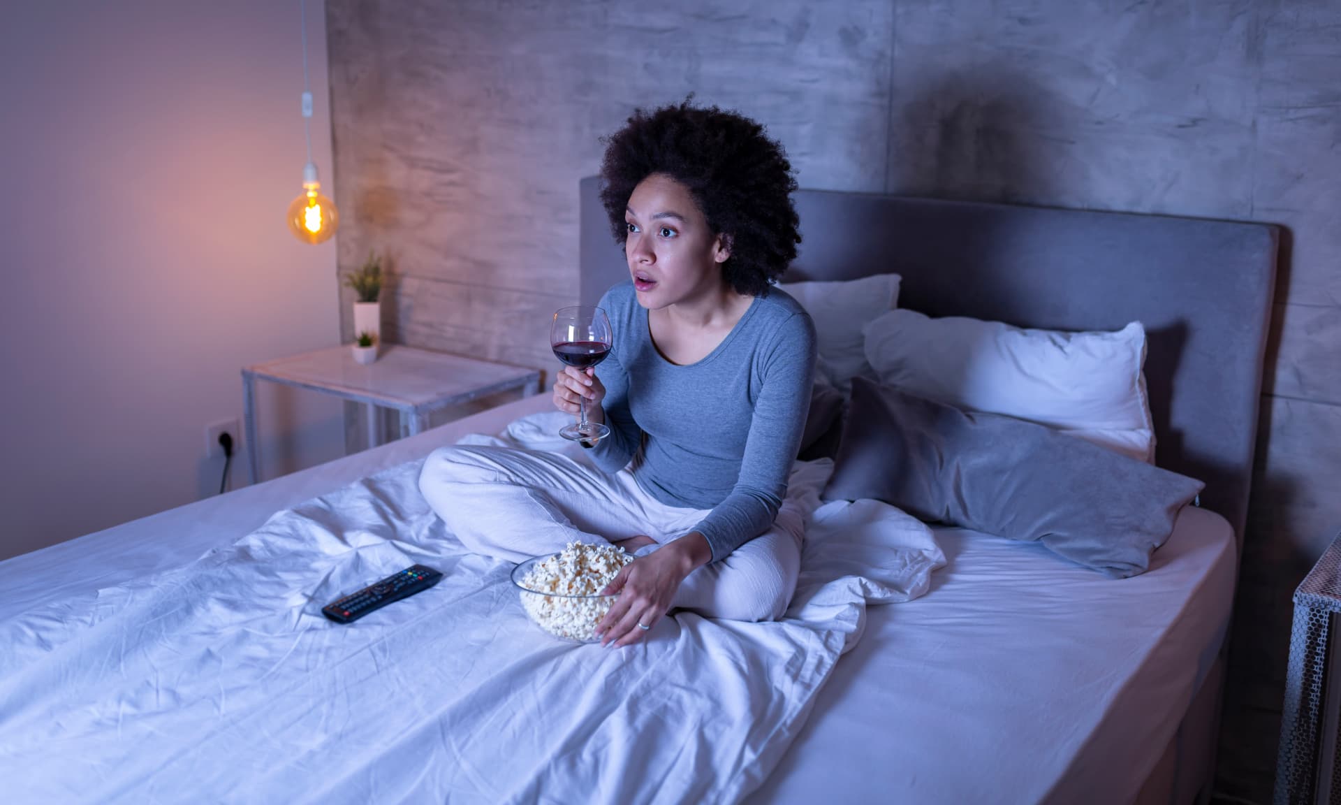 woman drinking in bed